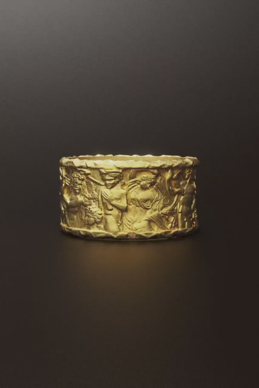 A handmade gold ring inspired by Greek mythology, crafted in 14k or 18k gold. The design, called 'Ariadne Dionysus,' features intricate details symbolizing the mythological connection between Ariadne and Dionysus, with a timeless band shape and artisanal craftsmanship.